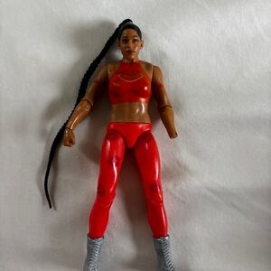 Red Action Figure with Long Braid